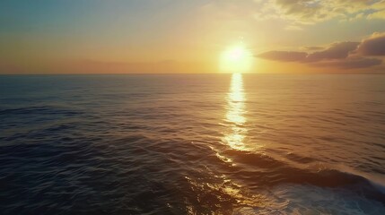 Naklejka premium Witness the ethereal blend of sea and sky at sunset from a mesmerizing aerial perspective captured by a drones lens Flight over the ocean Ocean loop video background : Generative AI