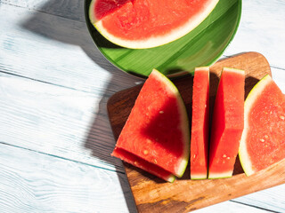Watermelon slices on wooden cutting board, summer fruit
