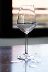 Broken glass of wine. Sadness after the breakup