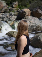 person on the rocks looking away