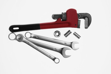Set of auto mechanic's tools on white background, flat lay