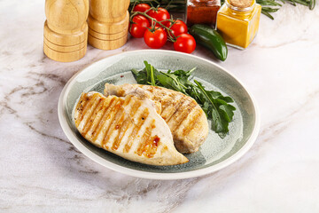 Grilled chicken breast served arugula