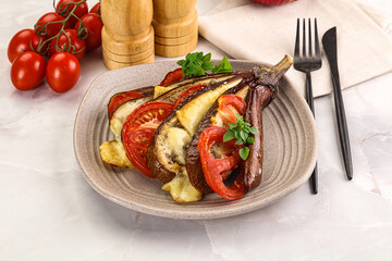 Baked tomato with mozzarella and tomato
