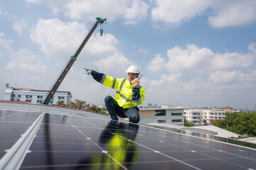 Engineer service check installation solar cell on the roof of factory. Silhouette technician inspection and repair solar cell on the roof of factory. Technology solar energy renewable.