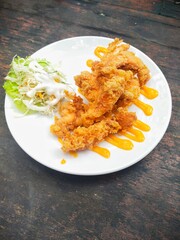 crispy chicken finger dish, tender finger-sized pieces of chicken breast then fried in crispy flour, served with mustard sauce and mayonnaise salad