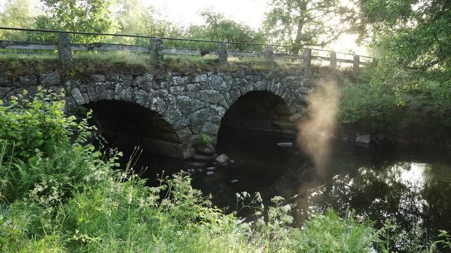 Old stone bridge by the river