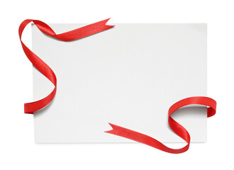 Red satin ribbon and blank card isolated on white, top view