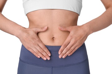 Fototapeta premium Healthy digestion. Woman making heart shape with hands near her belly on white background, closeup