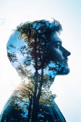 A creative double exposure of a man's profile merged with lush trees, symbolizing nature and human connection.
