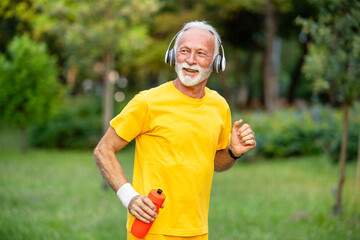 Fototapeta premium Active senior man running and training for good health.