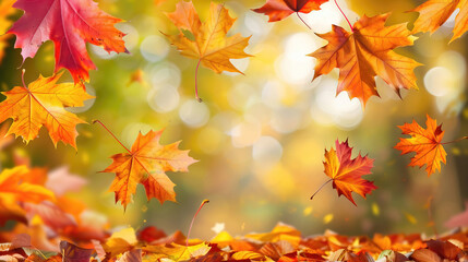 Autumn background with falling leaves blowing in the wind against a blurry background