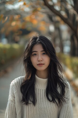 Naklejka premium indonesian women, with long black hair, blurred alley background, asian young woman, beautiful