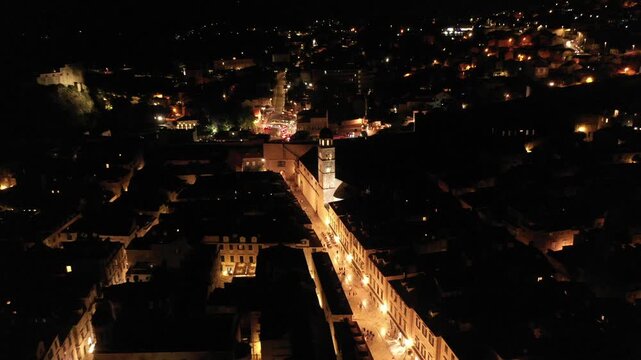 People strolling Stradun at night, lively atmosphere in Dubrovnik, Croatia