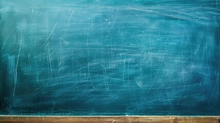 Blue chalkboard with chalk markings for background