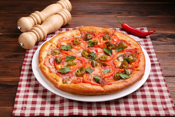 Delicious hot pizza Diablo on wooden table