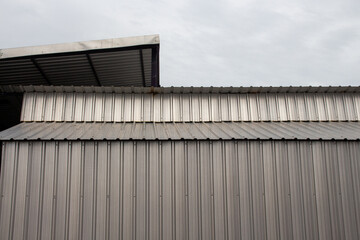 Buildings with metal sheets as walls close up.