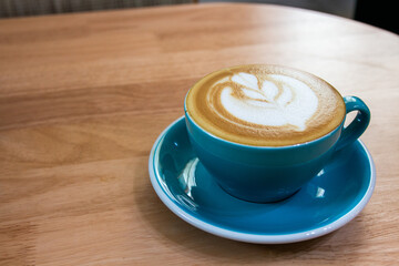 The art is on top of a hot Latte. closure