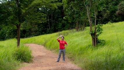 Portrait of Asia women walking on the meado