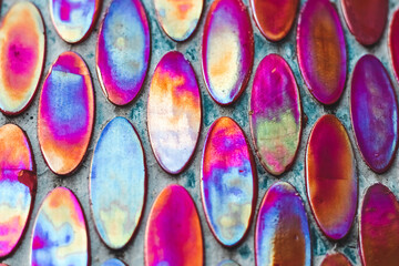 Texture of mother-of-pearl mosaic round tiles, close-up