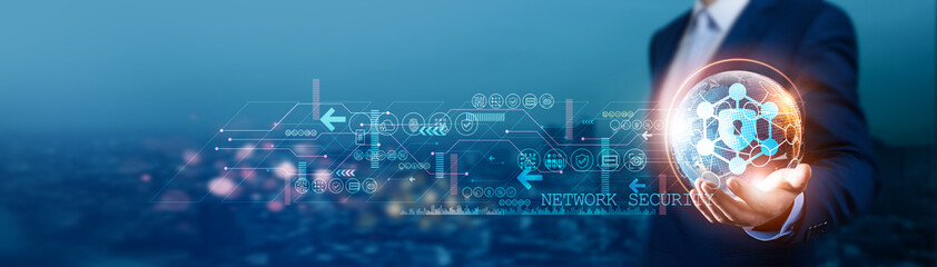 Businessman holds global network security with network connected to servers, data centers, and...