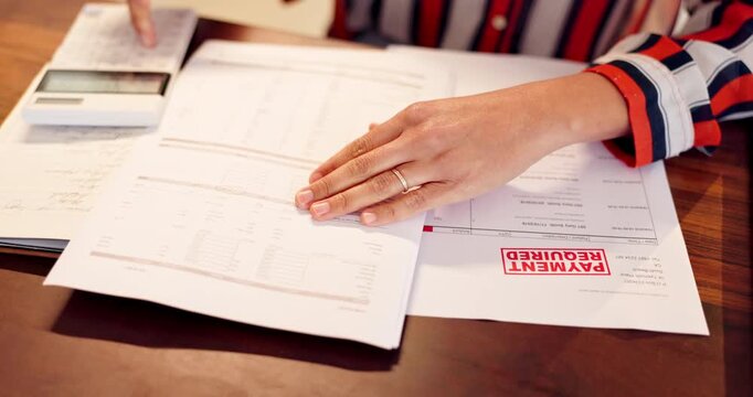 Woman, hands and writing with documents or calculator for payment, budget planning or finance on desk at home. Closeup of female person with calculation for expenses, cost or financial bills at house