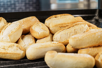 Freshly baked bread rolls on a tray