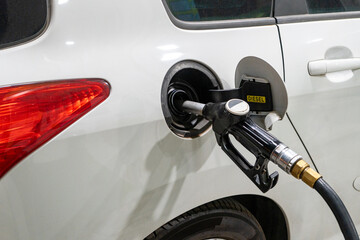 Refueling a car with diesel at a gas station