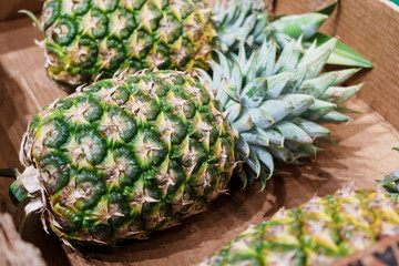 Fresh pineapples in a box