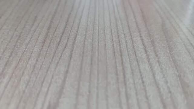 Texture of Light soft wooden parquet floor with natural pattern close-up. Forward movement. Treated wood texture. High quality 4k footage. Wood planks