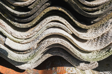 Old and very dangerous asbestos roof. Asbestos dust in the environment. Health problems.