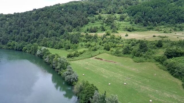 Aerial view of Kolpa River (Gorenjci pri Adle&scaron;ičih) in Slovenia (F0) Specs: 4K-60fps | 45Mbps Keywords: #4K, #QHD, #drone, #background, #river, #trees, #forest, #grassfield - DATE: June 23th, 2024