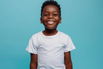 happy black boy wearing white t-shirt, in the style of mockup, on blue background