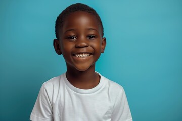 happy black boy wearing white t-shirt, in the style of mockup, on blue background