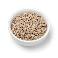 Bowl with shelled sunflower seeds close up isolated on white background