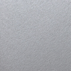 Close up of fine texture of a metallic sheet. Silver color metal plate with grainy texture background.