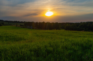 Obraz premium The Sabbath. National Sunset Day. Natural Green Grass Field in Sunset