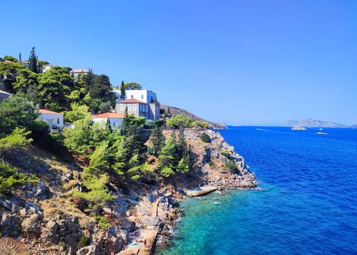 Photo of the idyllic Avlaki beach on Hydra Island s eastern side. This charming and serene spot is renowned for its crystal-clear waters and rocky shoreline.
