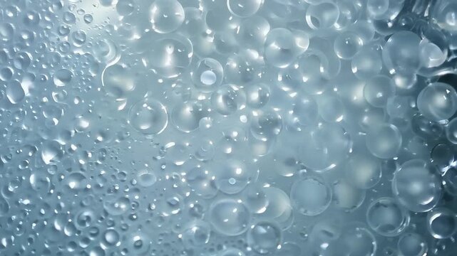 Background of bubbles and hydrogel with a blue tint. Concept: freshness and hydration of cosmetics