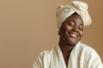 Smiling plus size black woman in bathrobe