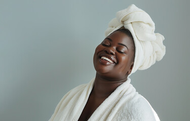 Smiling plus size black woman in bathrobe
