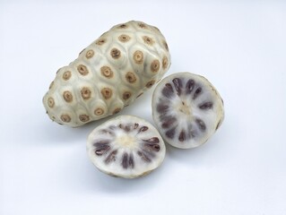 Morinda citrifolia Fresh Noni fruit isolated on white background 