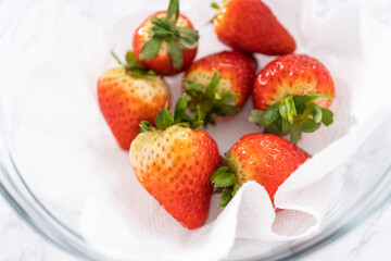 Washed and Dried Strawberries Neatly Stored in a Glass Bowl