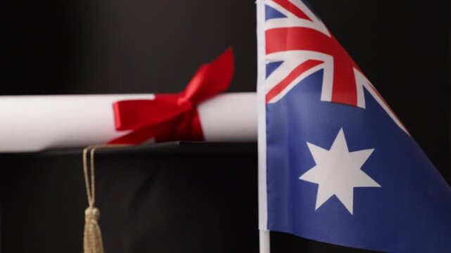 Australian education and language learning, graduation cap with diploma and flag of Australia