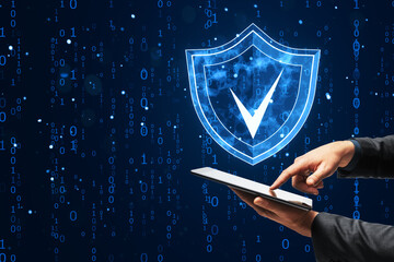 Digital shield icon with checkmark, man using tablet.