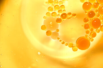 Mixed spherical oil bubbles float on the water.