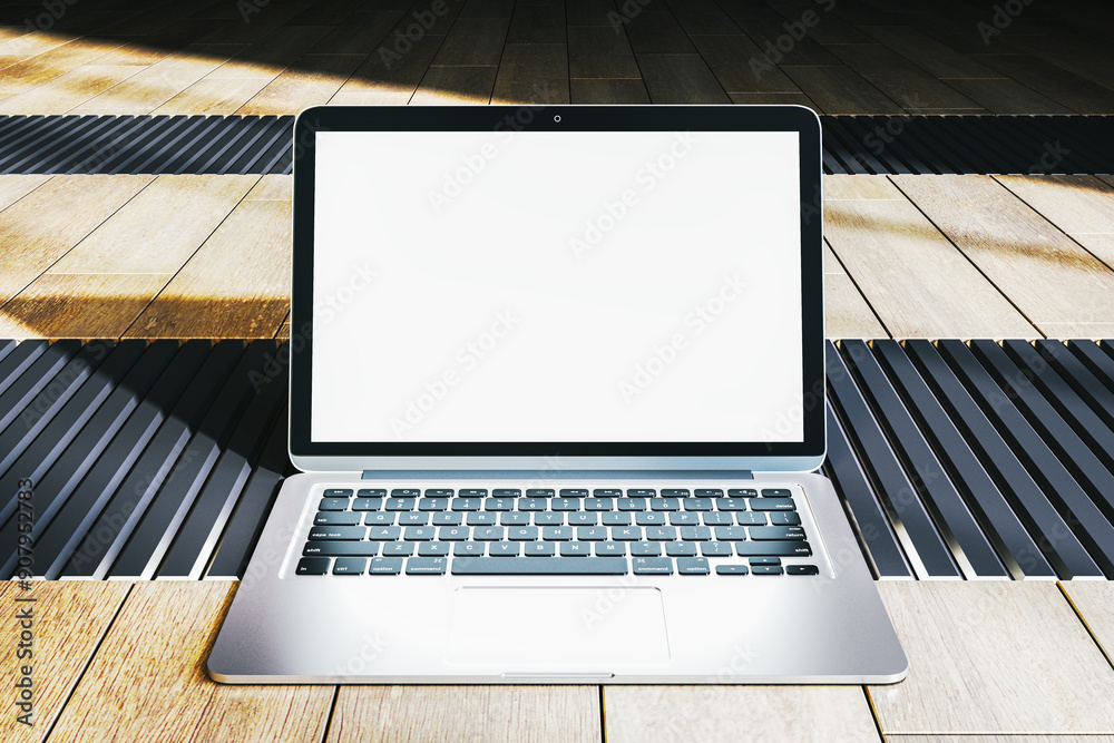 Poster modern laptop with blank screen on a wooden floor background. 3d rendering