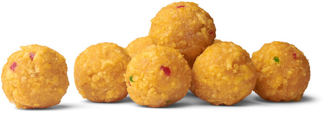 laddu, laddoo or ladoo isolated white background, popular traditional Indian sweet treats made during festivals, religious ceremonies and celebrations