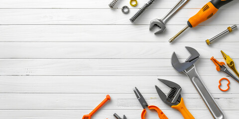 Assorted tools on white wooden surface