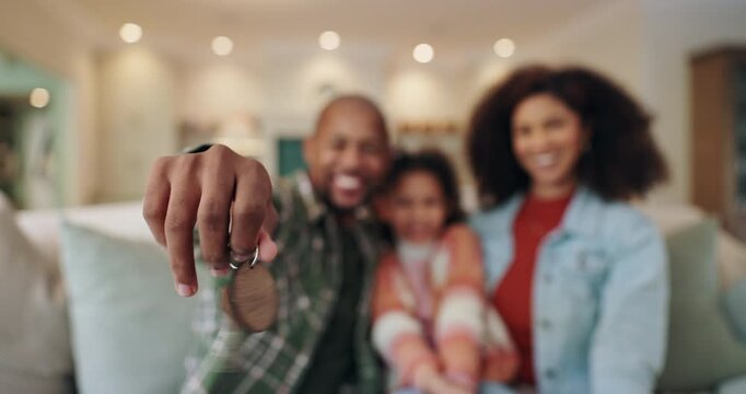 Hand, keys and family in new home for mortgage, loan or real estate investment. Property, mother and dad with child moving to dream house closeup to show keychain to celebrate relocation success