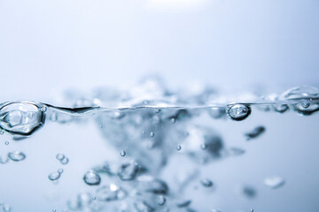 Clear blue water surface and air bubbles